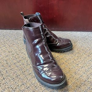 Shiny booties with chunky sole. Look nice on and are surprising comfortable.